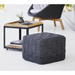 lifestyle image of cane-line cube footstool in Dark Grey, Square Cane-line Soft Rope in a patio with coffee table