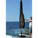 Woman putting Black Cover - Suitable for Cane-line Parasols 