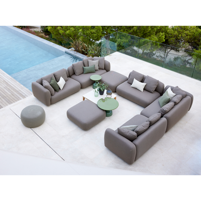 cane-line capture corner sofa with chaise lounge taupe, cane-line airtouch sofa in a patio with a pool and outdoor furniture lifestyle