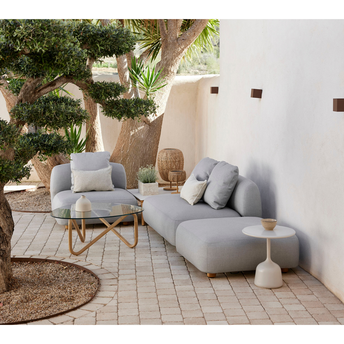 cane-line capture corner sofa with chaise lounge light grey, cane-line airtouch sofa in a patio with outdoor furniture lifestyle