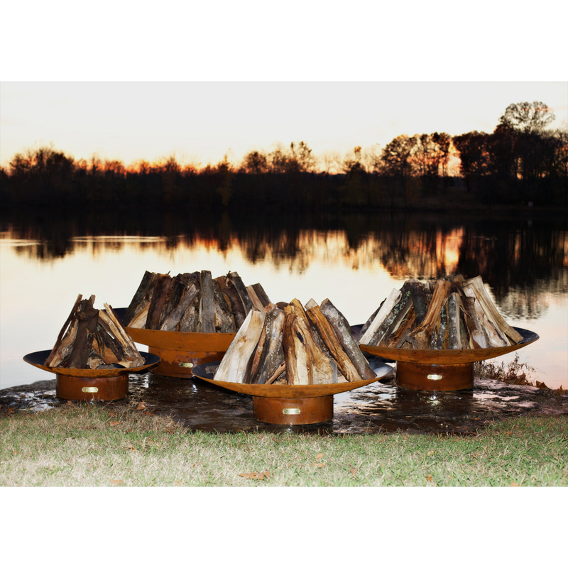 Fire pit art outdoor Asia 48" fire pit stainless steel with wood in a lake lifestyle