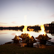 Fire pit art outdoor Asia 72" fire pit stainless steel with wood in a lake lifestyle