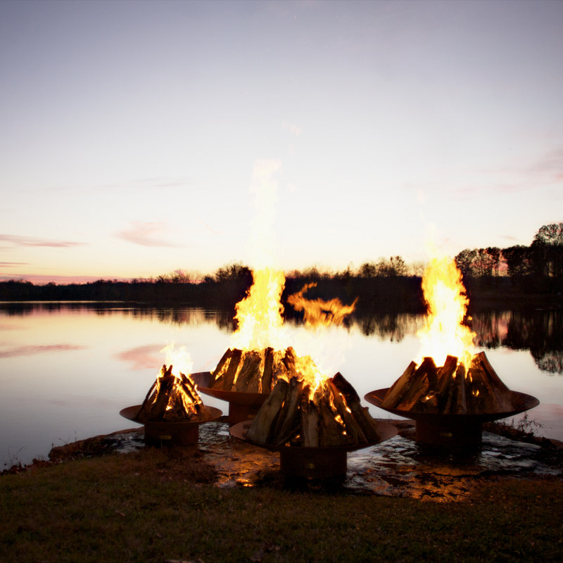 Fire pit art outdoor Asia 48" fire pit stainless steel with wood in a lake lifestyle