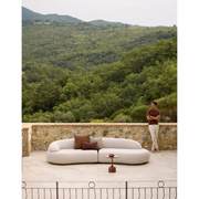 cane-line mellow 4-seater sofa sand, cane-line airtouch sofa in a patio with outdoor furniture lifestyle