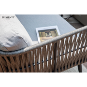 Elementi Milano Dark Grey Powder-Coated Frame w/ Granite Cushions Rope Weaving chair with a cushion and a magazine on a table