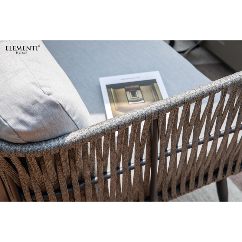 Elementi Milano Dark Grey Powder-Coated Frame w/ Granite Cushions Rope Weaving chair with a cushion and a magazine on a table