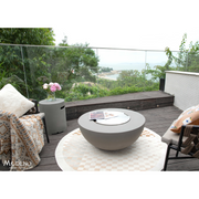 Modeno Roca Fire Table in a patio with cover and outdoor furniture lifestyle