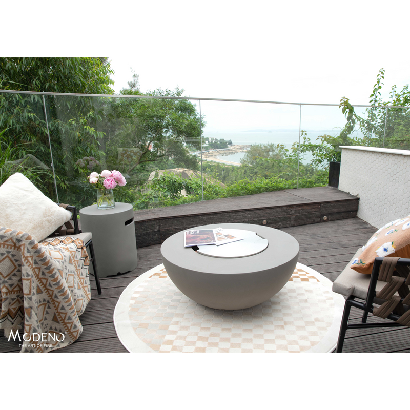 Modeno Roca Fire Table in a patio with cover and outdoor furniture lifestyle