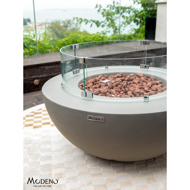 Modeno Roca Fire Table in a patio with wind screen lifestyle