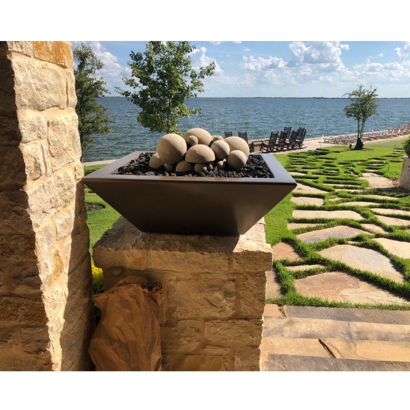 24" Maya Fire Bowl-GFRC CONCRETE chocolate in a garden lifestyle