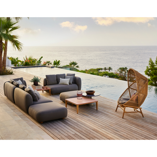 cane-line capture coffee table teak without table top in a patio with pool and outdoor furniture lifestyle