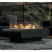 The Outdoor Plus Outdoor Fire pit on with wind guard outside by a patio
