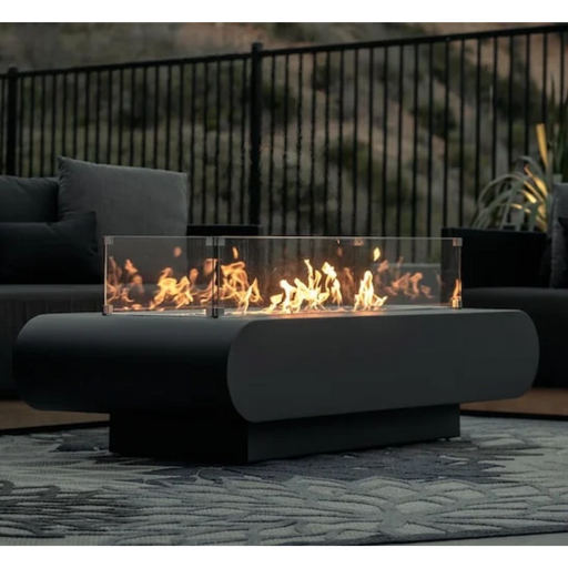 The Outdoor Plus Outdoor Fire pit on with wind guard outside by a patio