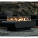 The Outdoor Plus Outdoor Fire pit on with wind guard outside by a patio