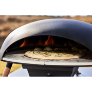 Le Feu Turtle Black Gas Powered Pizza Oven with pizza lifestyle