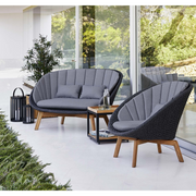 Caneline Peacock lounge chair Dark grey, medium flat Cane-line Soft Rope w/teak and Grey, Cane-line Natté cushion in a patio ifestyle