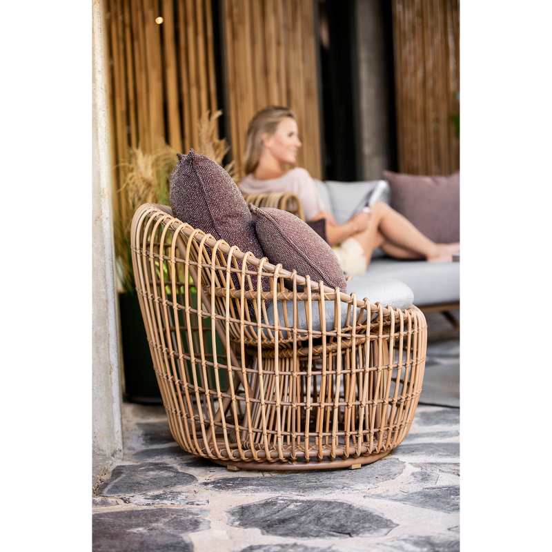 Cane line Nest outdoor round chair Natural Light Grey Natte cushion in a patio lifestyle