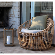 Cane line Nest outdoor round chair Natural Light Grey Natte cushion in a patio lifestyle