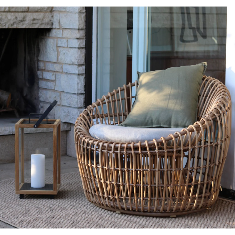 Cane line Nest outdoor round chair Natural Light Grey Natte cushion in a patio lifestyle