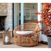 Cane line Nest outdoor round chair Natural Light Grey Natte cushion in a patio lifestyle