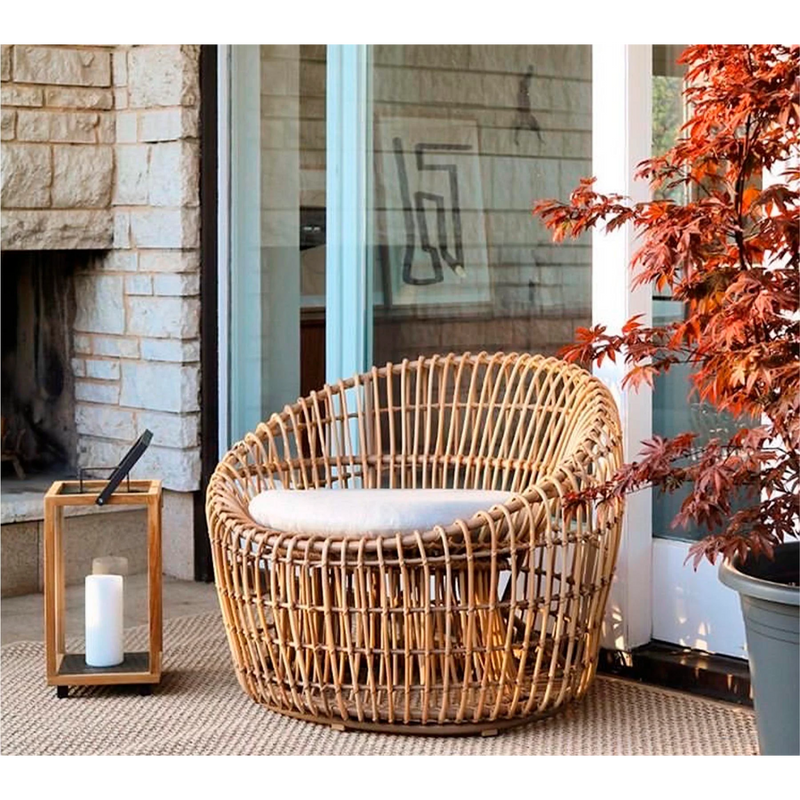 Cane line Nest outdoor round chair Natural Light Grey Natte cushion in a patio lifestyle