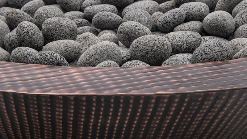 Copper fire bowl outdoor rocks lifestyle