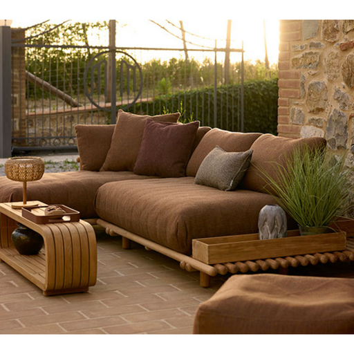 sticks platform sofa w/ chaise lounge Teak Umber brown Cane-line Rise in a patio with outdoor furniture lifestyle