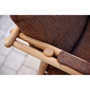 cane line Sticks armchair Teak Umber brown Cane line Rise cushion texture lifestyle