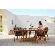 cane line Sticks armchair Teak Umber brown Cane line Rise cushion lifestyle with dining table